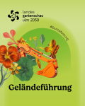 Baggerschaufel in Orange auf gr&uuml;nem Hintergrund, Kapuzinerkresse, die sich um Bagger schlingt.