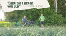 Gaby und Jürgen mit ihrem Fahrrad in der Natur.